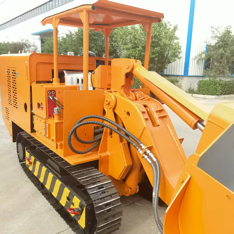 Крупногабаритный погрузчик для боковой разгрузки горных пород.