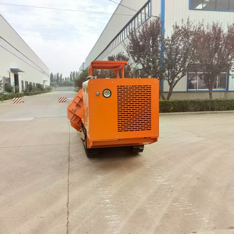 Cargador de rocas de descarga lateral 100