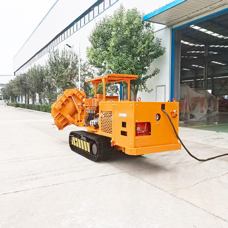 Carregadora de rochas sobre rastos