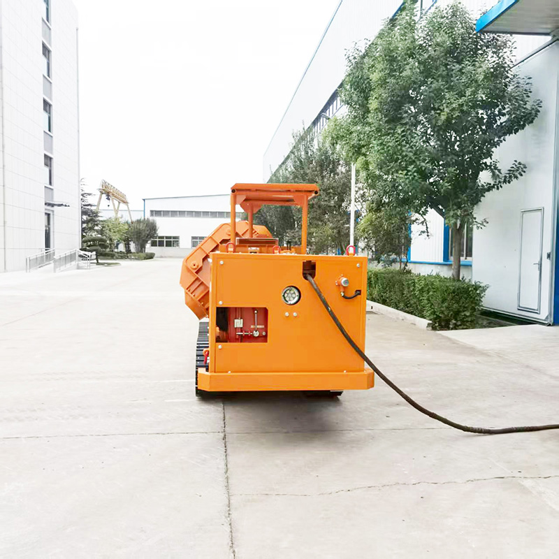 Carregadora de rochas sobre rastos