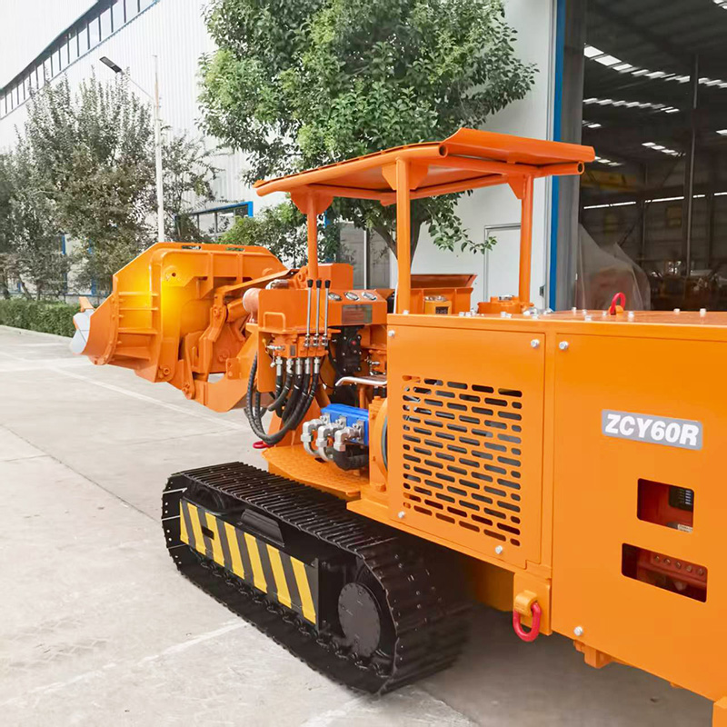 Chargeuse de roches à déchargement latéral hydraulique