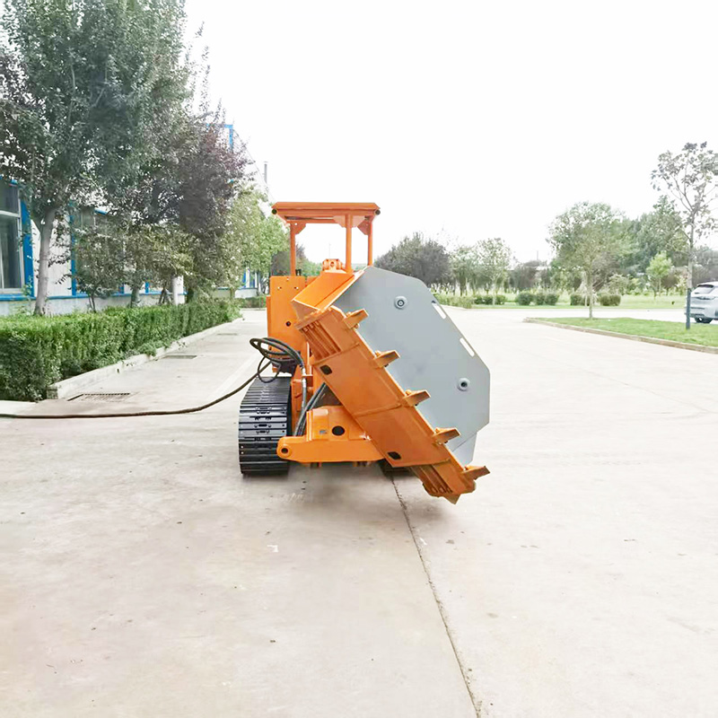 Carregador de rochas com rastos e descarga lateral