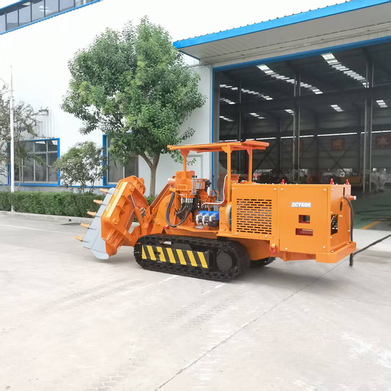 Chargeuse de roches à déversement latéral pour ingénierie