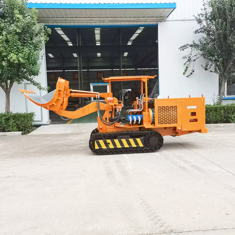 Chargeuse de roches à déversement latéral pour ingénierie