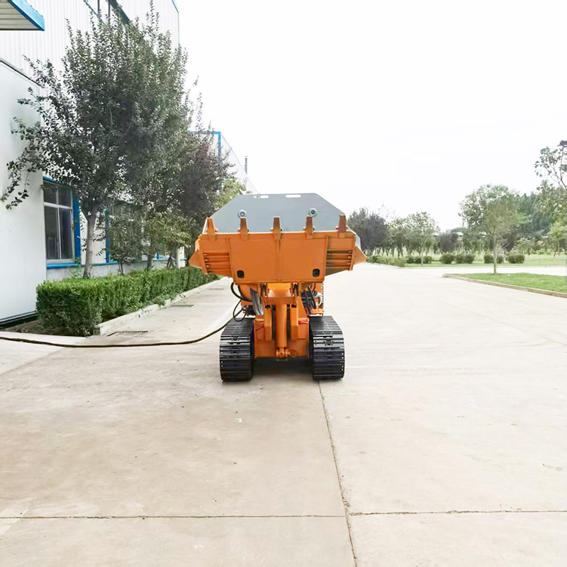 Chargeuse de roches à déversement latéral pour ingénierie